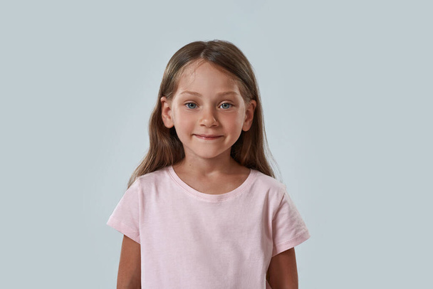 Cropped of smiling little girl looking at camera - Photo, image