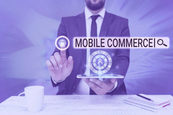 Inspiration showing sign Mobile Commerce. Word for Using mobile phone to conduct commercial transactions online Man holding Screen Of Mobile Phone Showing The Futuristic Technology. - Photo, Image