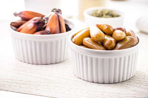 pine nuts in a rustic wooden bowl, traditional food of the Brazilian June festivals, served hot and cooked. - Photo, Image