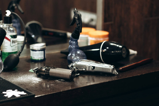 Professional barbering tools of hairdresser on table. Tools for cutting beard and hair barbershop. - Foto, afbeelding