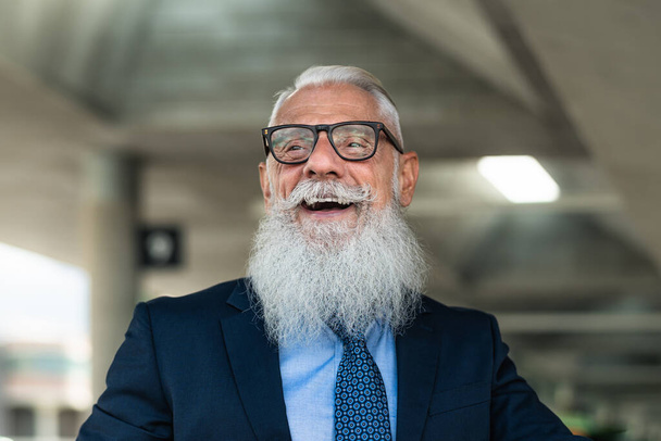 Portrait of happy fashion senior man going to work in office - Elderly people lifestyle concept - Photo, Image