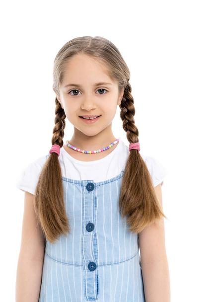 pleased girl in multicolored necklace looking at camera isolated on white - Photo, Image