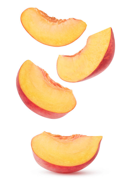 Isolated peach slices. Four wedges of pink peach fruit isolated on white background - Photo, Image