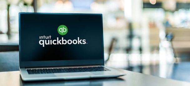 POZNAN, POL - SEP 23, 2020: Laptop computer displaying logo of QuickBooks, an accounting software package developed and marketed by Intuit - 写真・画像