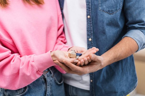 Cropped view of couple holding key at home  - Fotoğraf, Görsel