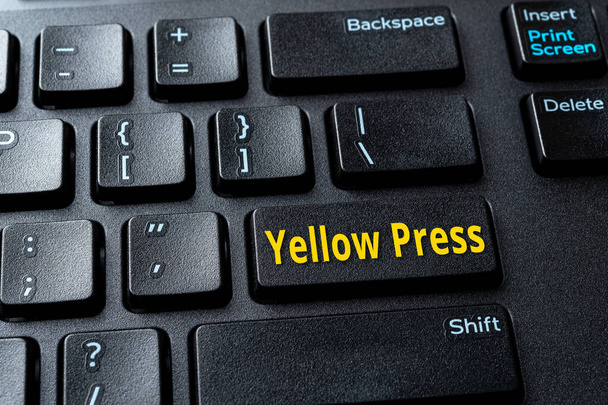 Yellow Press enter key on the black pc keyboard. Concept of disinformation, lies and hoax in the media. Spread false information on the Internet. Computer enter key with word message. Close-up. - Fotoğraf, Görsel