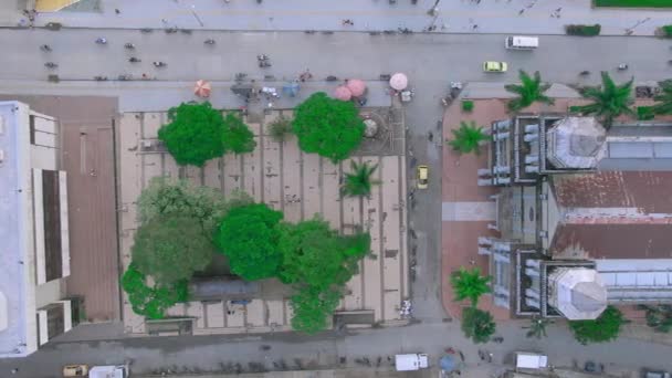 Toma aerea de catedral catolica de Quibdo Choco con arboles al rededor. - Filmmaterial, Video