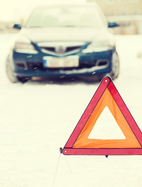 closeup of warning triangle and car - Fotó, kép