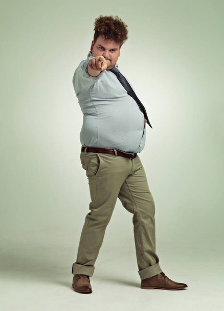 You Light up my life.... Full length shot of an overweight man pointing at the camera. - Foto, imagen