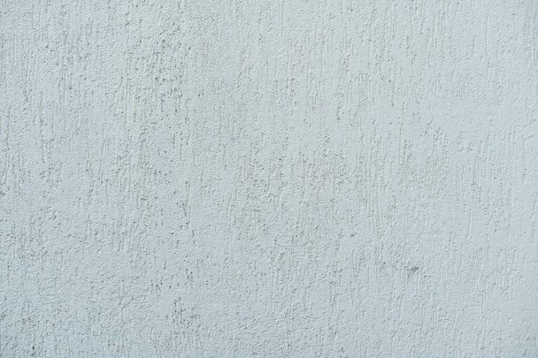 Patrón de yeso decorativo y texturizado beige claro. Materiales de construcción y acabado para la reparación de paredes en apartamentos, casas y oficinas. Fondo y textura para el diseño y la decoración - Foto, imagen