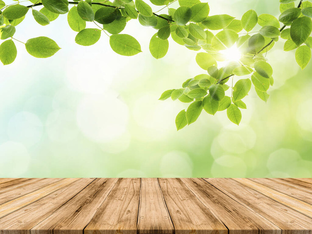 Wooden Table Top with Nature Background can be used mock up for montage products display or design key visual layout - Foto, immagini