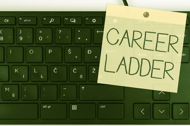 Conceptual display Career Ladder. Concept meaning Job Promotion Professional Progress Upward Mobility Achiever Computer Keyboard And Symbol.Information Medium For Communication. - 写真・画像