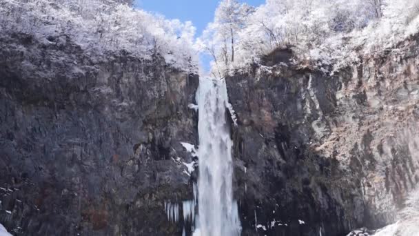 Waterfall Kegon with snowy basalt wall. Frozen waterfall. Kegon fall in winter. - Footage, Video