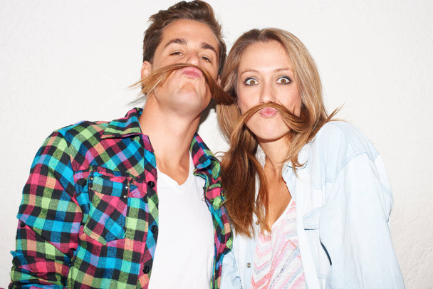 Check our moustaches. Shot of a stylish hipster couple. - Foto, afbeelding