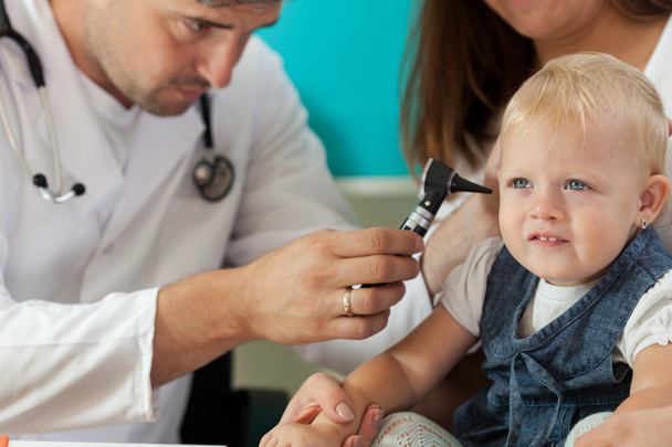Pediatrician checking girl ears  - Photo, Image