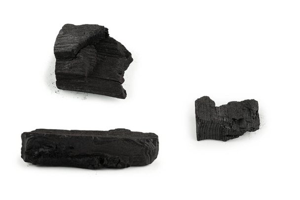 Black oak coal isolated on a white background.  - Foto, imagen