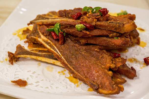 A crispy and delicious Guangxi dish, pork fan bone with salt and pepper - Photo, Image