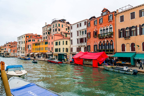 Venice, Italy - April 2, 2022: Beautiful canals and traditional Venetian buildings in Venice, Veneto, Northeast Italy. - Fotoğraf, Görsel