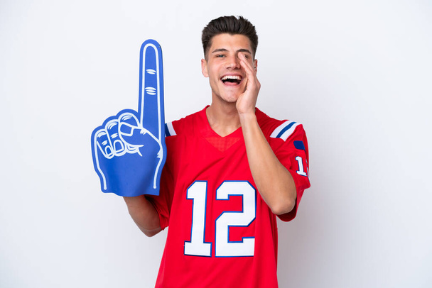 Young caucasian sports fan man isolated on white background shouting with mouth wide open - Photo, Image