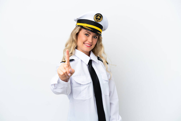 Airplane Brazilian pilot isolated on white background showing and lifting a finger - Photo, Image
