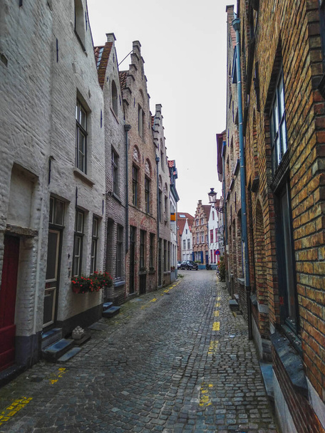 Historical town center with medieval architecture in Bruges, Belgium - Fotó, kép