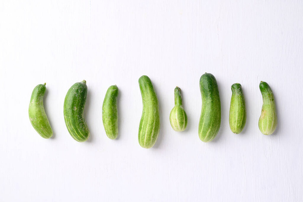 Organic cucumber on white background, Imperfectly shape, Food trend - Fotografie, Obrázek