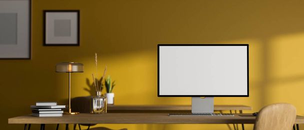 Moderner stilvoller kreativer Arbeitsplatz mit Desktop-Computer-Attrappe und Zubehör auf dem Tisch vor gelber Wand mit Rahmen-Attrappe. 3D-Darstellung, 3D-Illustration - Foto, Bild