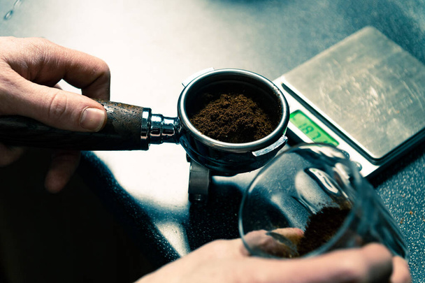 coffee cup with a grinder on a wooden background - Fotó, kép