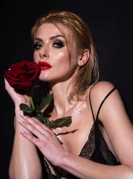 Portrait of a woman with a Portrait of attractive woman with red rose. rose flower. Beauty fashion model woman face. Nofilter unaltered skin. - Фото, зображення