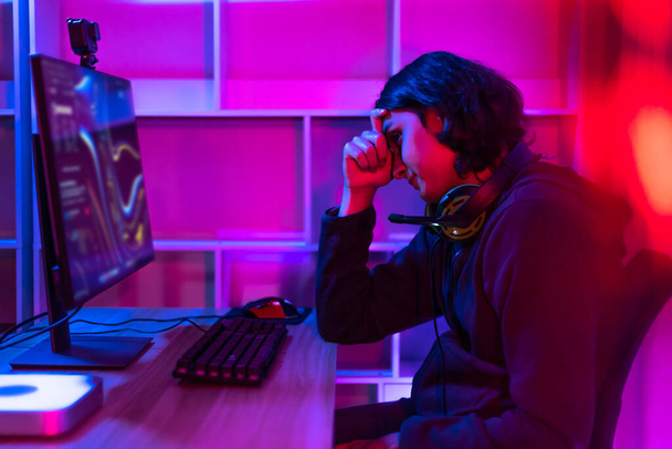 Men play E-Sport games or streamers, Lost the match, Male stressed after being criticized and scolded by the audience, Technology game trends, Hurt the feelings, sadl - Фото, изображение