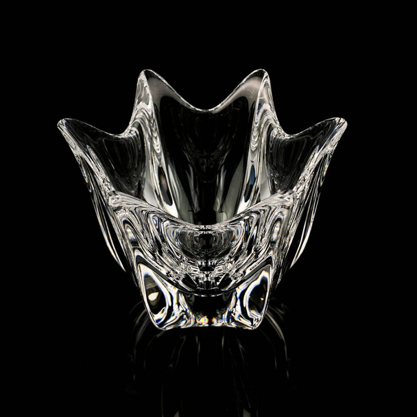 crystal antique figured vase. vintage glass vase in the shape of a flower on a black isolated background - Φωτογραφία, εικόνα