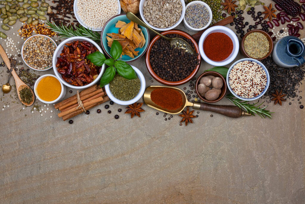 Selection of spices and herbs used to add flavor and seasoning to food during cooking. Space for Text. - Foto, imagen