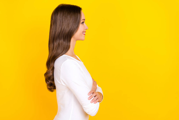Profile photo of pretty positive cheerful manager lady crossed arms wear white shirt isolated yellow color background - Φωτογραφία, εικόνα