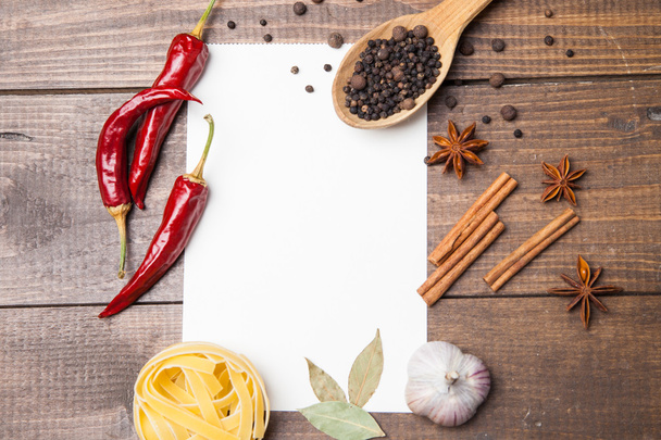 blank paper with pasta, pepper and spices - Фото, зображення