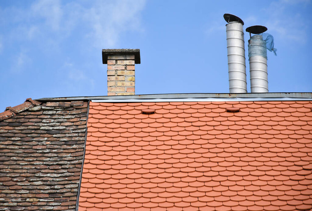 Smoke stacks on the roof of a house - Photo, Image
