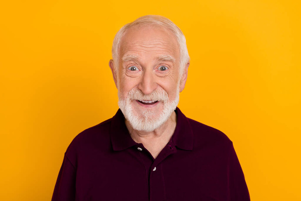 Photo of senior cheerful man good mood toothy smile wear casual outfit isolated over yellow color background - Foto, immagini