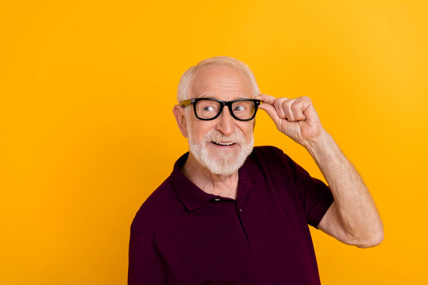 Photo of senior man wonder dream look empty space minded clever isolated over yellow color background - Фото, изображение