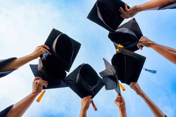 Graduation Caps Thrown in the Air success graduates of the university,Concept education congratulation graduates in University. - Photo, Image