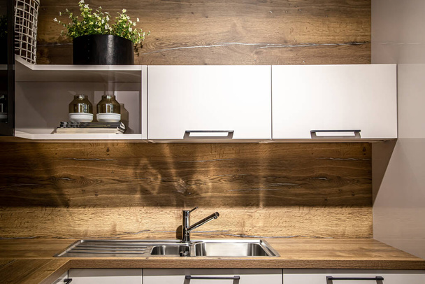 Interior of a modern kitchen with wooden details. - Foto, imagen