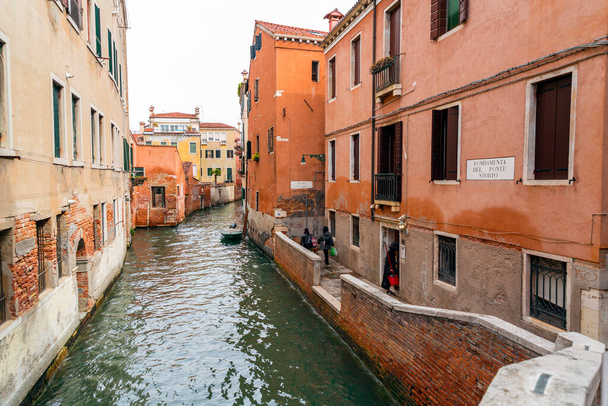 Venice, Italy - April 2, 2022: Beautiful canals and traditional Venetian buildings in Venice, Veneto, Northeast Italy. - Fotografie, Obrázek