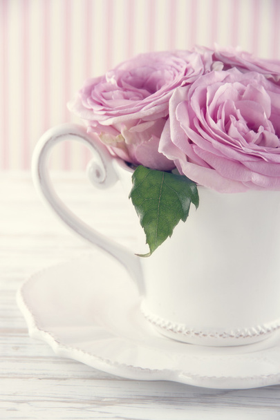 Cup filled with a bouquet of romantic pink roses3 - Photo, Image
