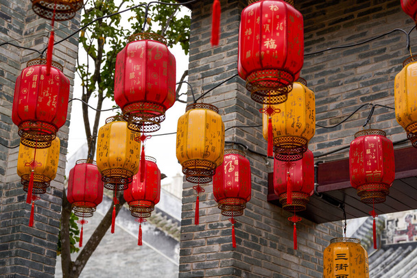 Close-up of traditional blessing lanterns in ancient Chinese architecture. Translation: Happy New Year. - Photo, Image