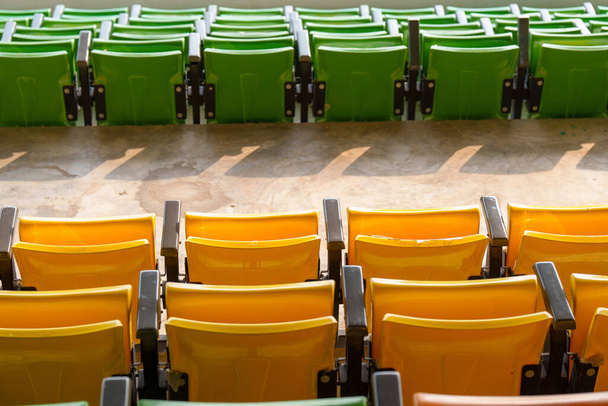 Empty plastic stadium seats on the football stadium at the arena - Фото, изображение