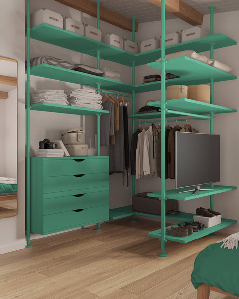 Modern minimalist bedroom walk in closet close up in turquoise tones. Mirror, parquet floor, chest of drawers and shelves. Hanging clothes, boxes, shoes. Contemporary interior design - 写真・画像