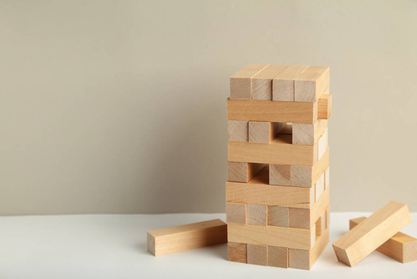 Blocks of wood on grey background, Strategy game as a business plan for team work. Space for text - Foto, Imagen