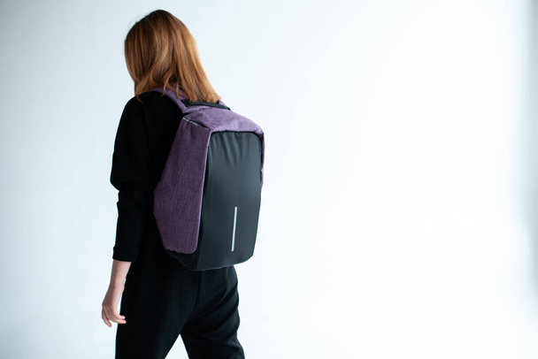 stylish hipster person holding modern backpack bag on white background - Foto, Imagem