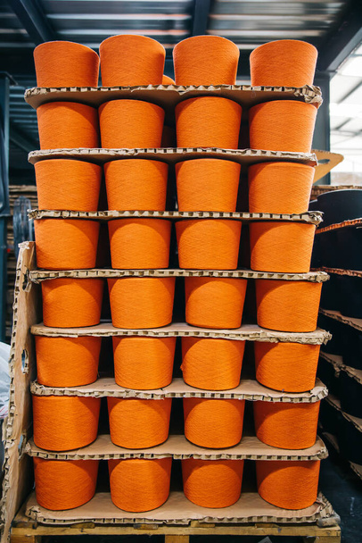 Cotton yarns or threads on spool tube bobbins at cotton yarn factory - Fotografie, Obrázek