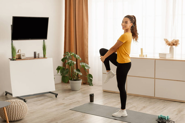 African American Fitness Female Stretching Leg Exercising Standing At Home - Φωτογραφία, εικόνα