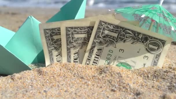 Green small paper boat, half three dollar paper bills, paper cocktail umbrella - Footage, Video