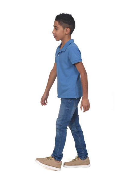 side view of boy walking on white background - Photo, Image